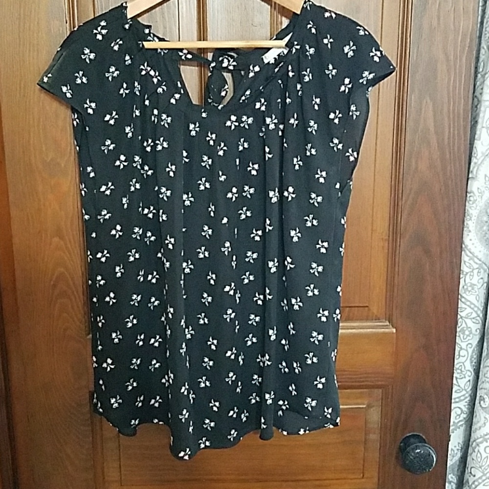 Black blouse with white and red bow pattern